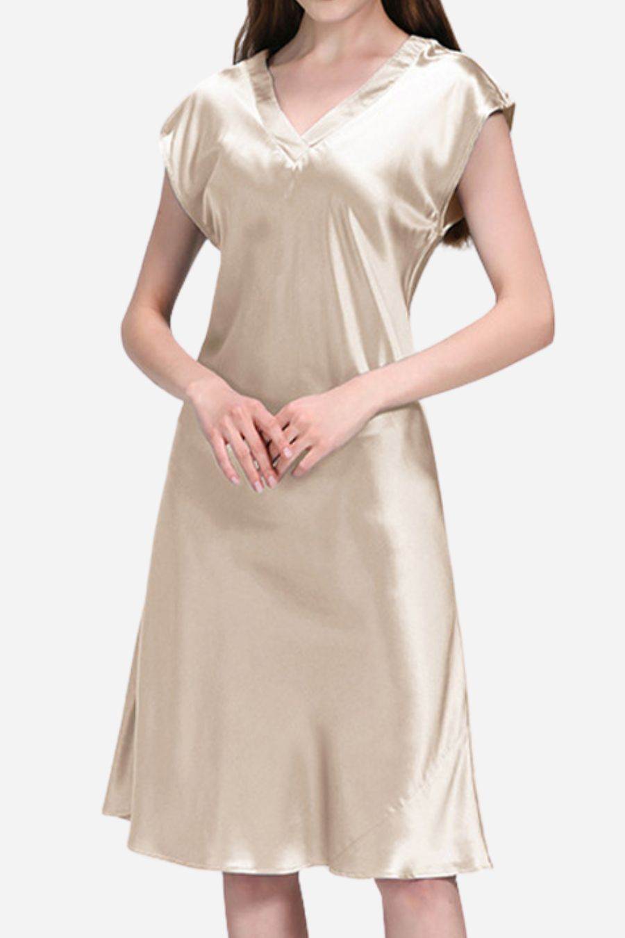 Woman wearing luxurious beige Mulberry Silk V-Neck Nightgown with short sleeves and flowing silhouette