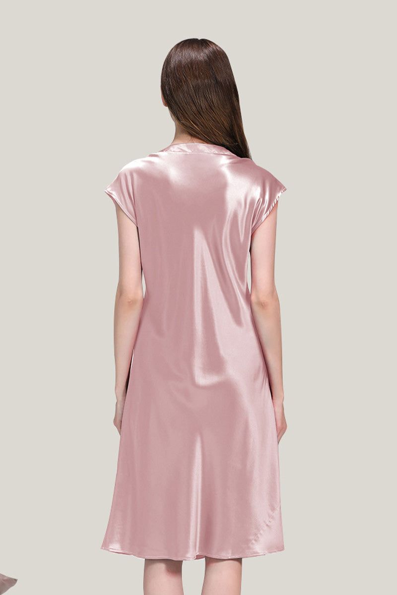 Back view of a woman wearing a pink Mulberry Silk V-Neck Nightgown showing smooth, lightweight, and flowing fabric.
