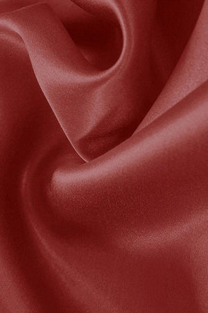 Close-up of smooth red mulberry silk fabric for elegant night dress