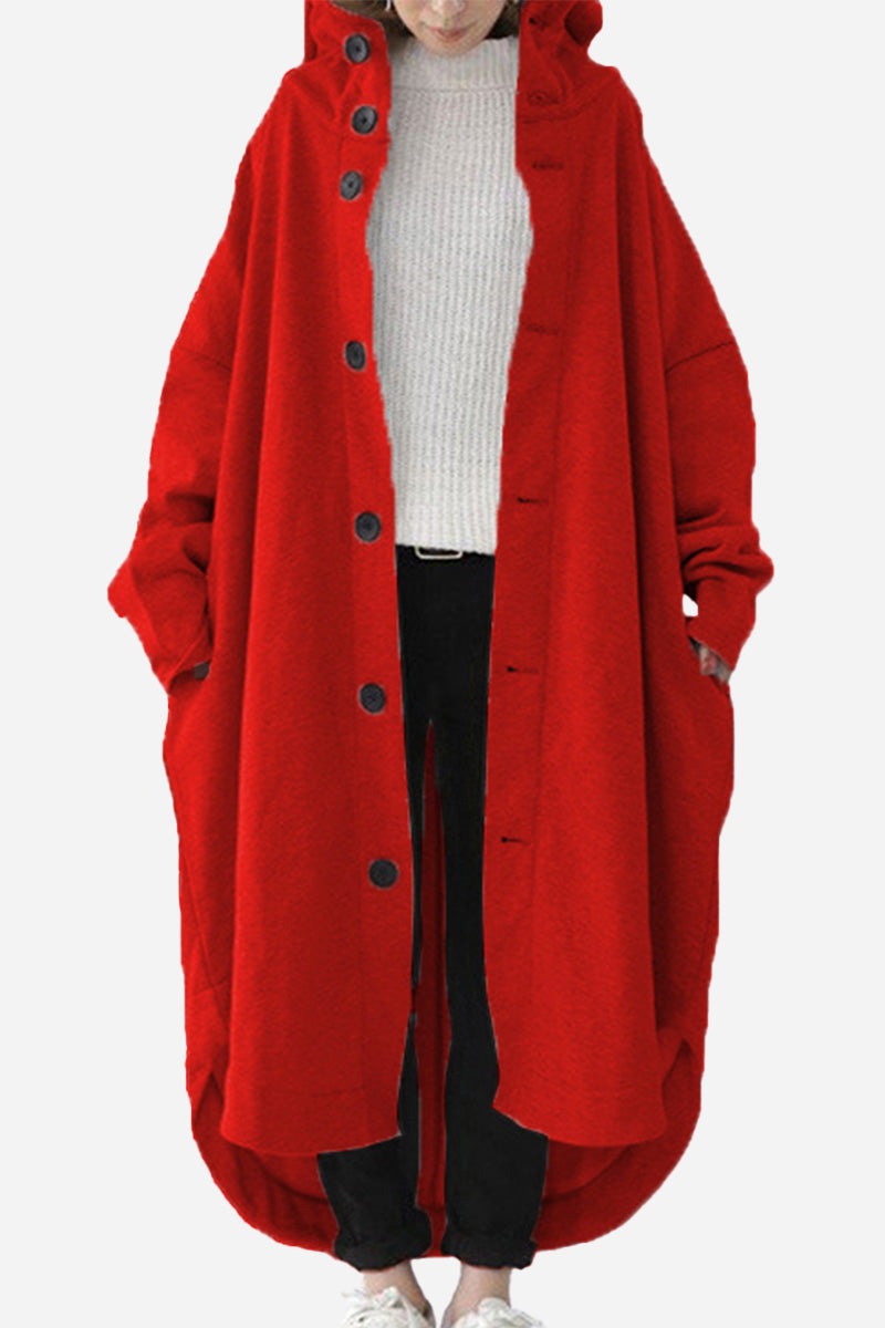 Woman wearing a red oversized everyday buttoned hooded coat with roomy pockets and relaxed fit