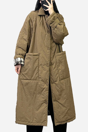 Plus size oversized brown windbreaker parka with large front pockets and long sleeves.