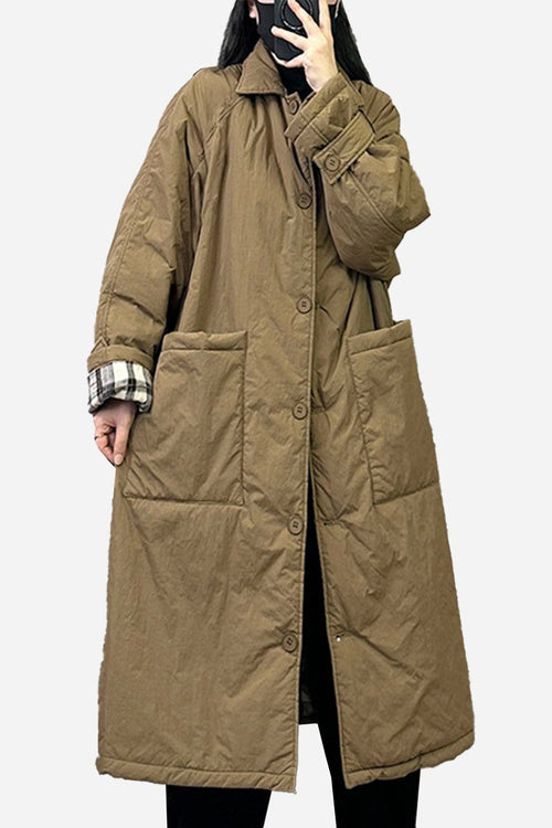 Plus size oversized brown windbreaker parka with large front pockets and long sleeves.
