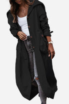 Black minimalist hooded coat with oversized fit, button front, and pockets worn over casual outfit