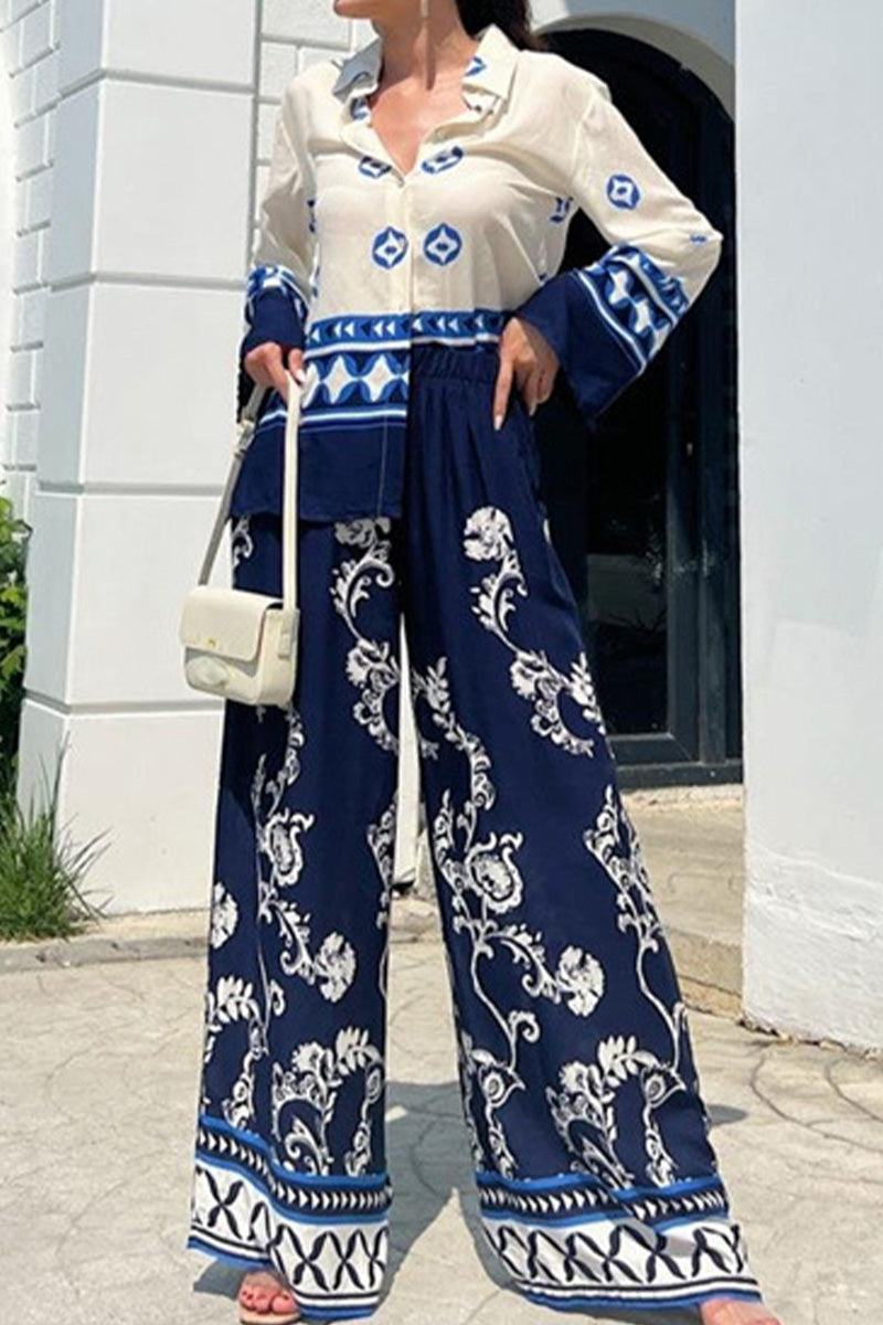 Mediterranean two-piece set women's outfit with blue and white porcelain print, long sleeve blouse and wide-leg pants.