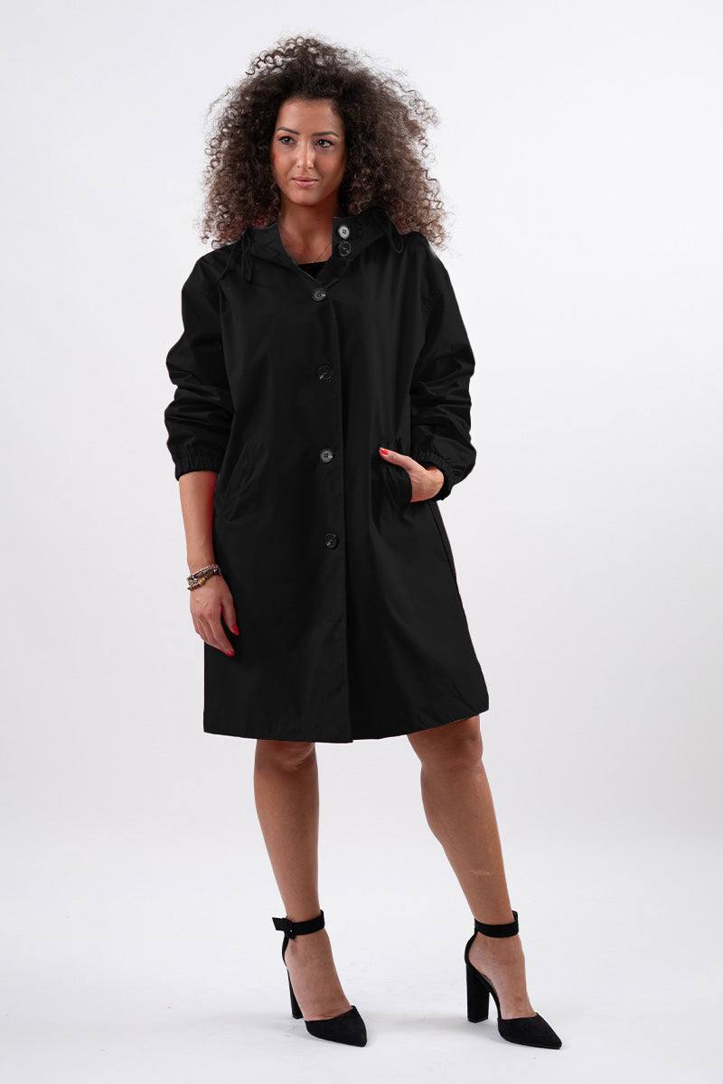 Travel-smart waterproof hooded windbreaker in black with adjustable hood and sleek design for elegant rain protection.