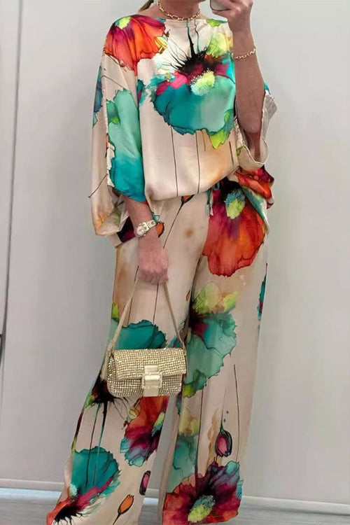 plus size vibrant floral matching set with colorful abstract flower prints on flowy top and pants