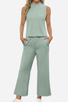 Cotton Chic Sleeveless two-piece set in soft green polyester-cotton blend with sleeveless top and wide-leg pants with pockets