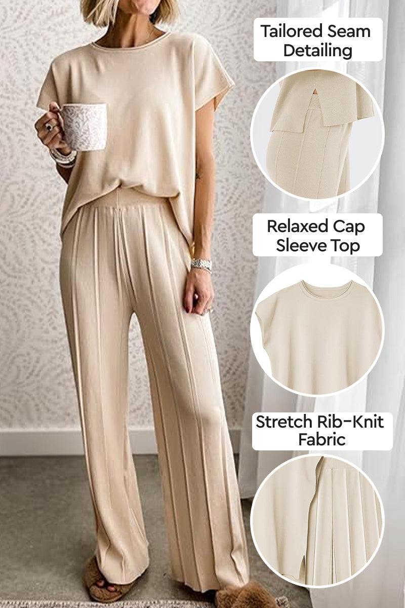 First Class Travel two-piece set with tailored seams, relaxed cap sleeve top, and stretch rib-knit fabric in neutral beige.