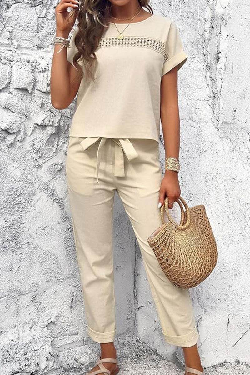 Beige 100% cotton Total Comfort Two-Piece Set with short sleeves and drawstring pants, styled casually with a woven handbag.