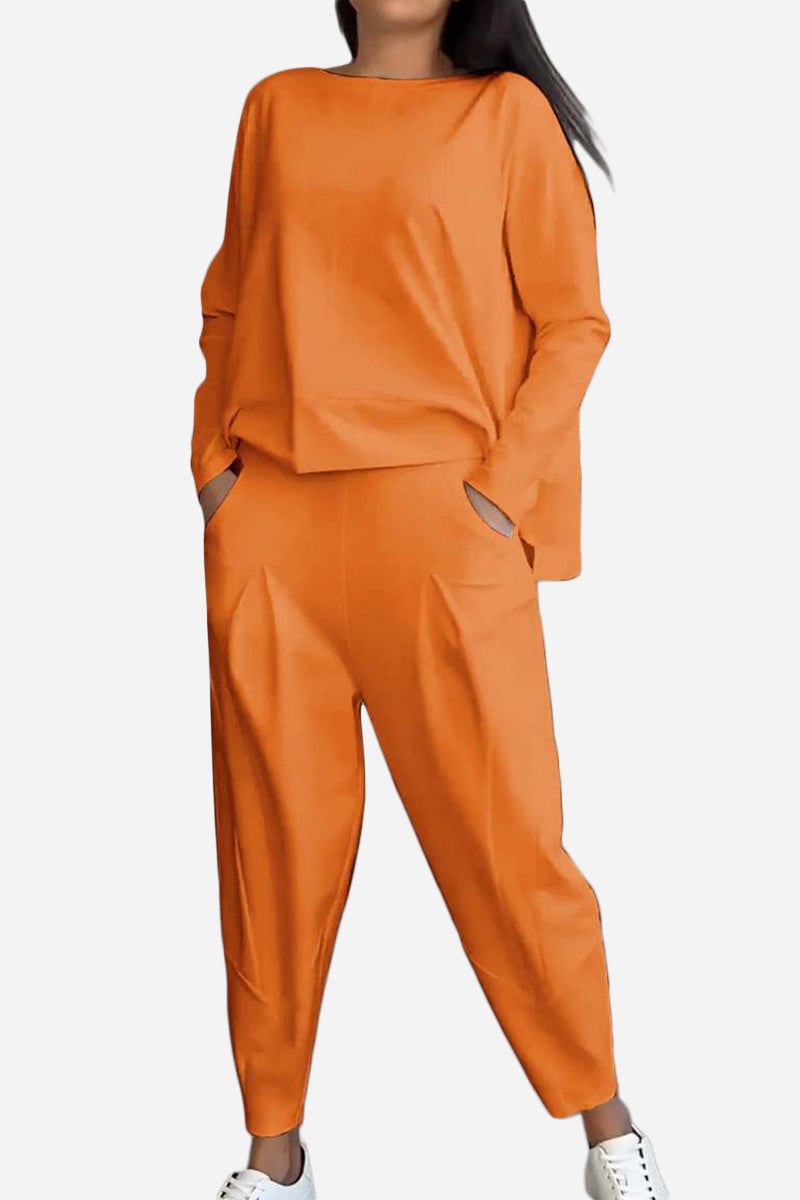 Woman wearing orange All-Day Comfort 2-Piece Outfit Set with long sleeves and relaxed fit pants.