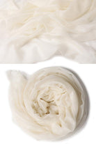 Soft white 100% cashmere featherlight luxury scarf, lightweight and warm with a smooth texture.