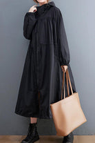 One size oversized black all-weather water-resistant windbreaker with hood and long sleeves