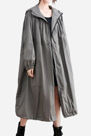 One size oversized all-weather water-resistant windbreaker in neutral color, long and roomy design for comfortable layering and weather protection.