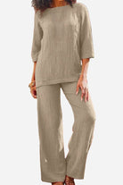 Woman wearing beige textured two-piece set with loose fit and three-quarter sleeves