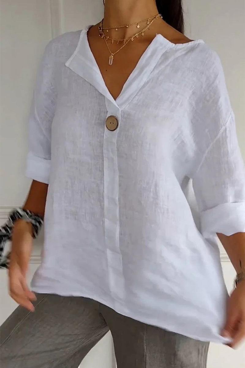 White pure linen age-defying shirt with button detail, breathable and relaxed fit for mature skin.
