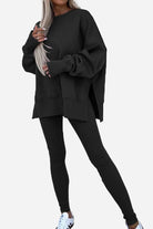 Woman wearing black TimelessChic Ultra Comfortable Two-Piece Set with oversized top and leggings