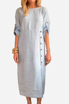 Light blue Pure Cotton Elegance dress with buttons and 3/4 roll-up sleeves on female model