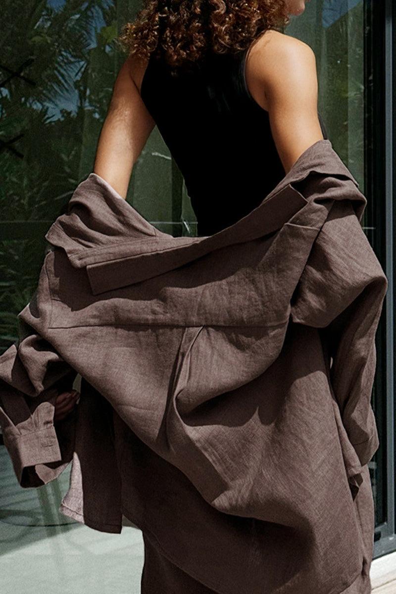 Woman wearing loose brown 100% cotton Wanderlust two-piece set jacket outdoors