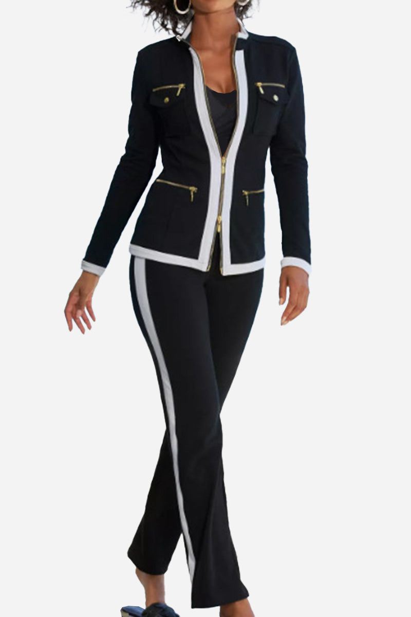 Women's sleek contrast zip two-piece outfit with black and white trim, zipper details, and fitted silhouette