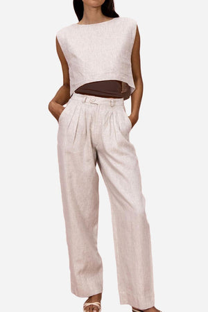 Woman wearing beige cotton-linen blend wide-leg pants and cropped sleeveless top summer outfit