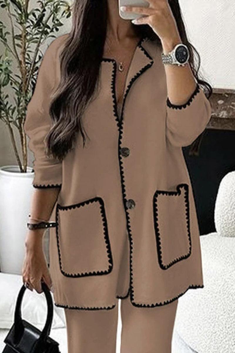 Women's beige contrast-trim knit cardigan with button front and pockets, styled with matching pants.