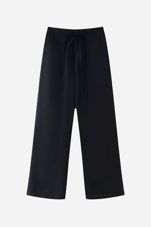 Black wide-leg pants from Mix-Match Lounge-to-Travel Set with a relaxed fit and drawstring waist.