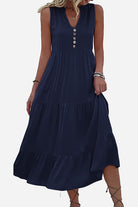 Bohemian tiered midi dress with V-neck button detail in navy blue, sleeveless and flowy design