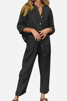 Woman wearing black casual chic two-piece set with long sleeves and relaxed fit pants