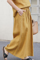 100% linen wide-leg pants with elastic waist in mustard color, breathable and comfortable fit for everyday wear