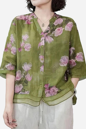 French boutique style organza blouse with green base and pink floral print, lightweight and elegant design