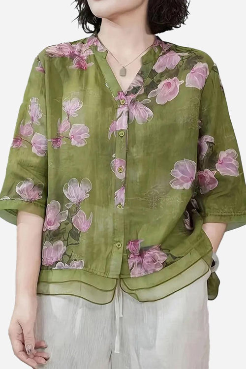 French boutique style organza blouse with green base and pink floral print, lightweight and elegant design