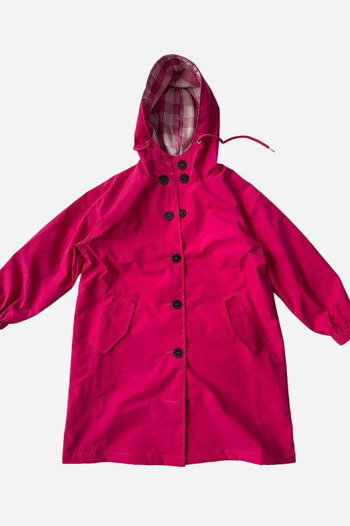 Junior water resistant oversized hooded windbreaker rain jacket for kids in bright pink polyester