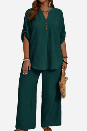 Wrinkle-free wide leg pants and button-front top travel outfit in dark green polyester fabric