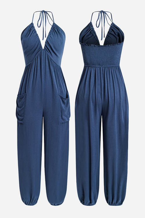 Sunshine On Sand navy blue halter-neck jumpsuit with ruched neckline and elastic ankle cuffs