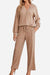 Woman wearing beige Desert Bloom Ribbed Comfort Set with long sleeves and wide-leg pants.