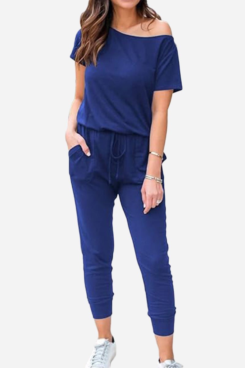Moonlit Rome Off-Shoulder Jumpsuit in navy blue with comfortable fit and functional pockets