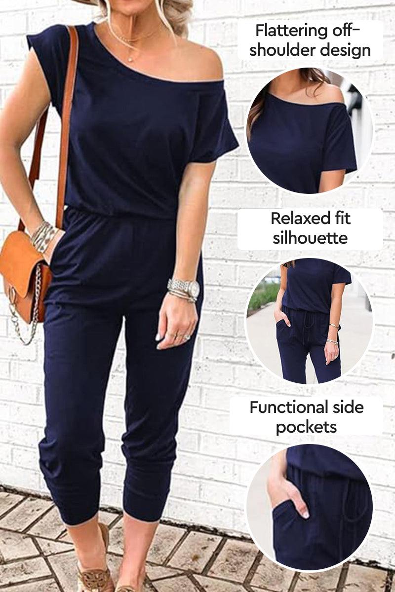 Moonlit Rome Off-Shoulder jumpsuit with flattering off-shoulder design, relaxed fit silhouette, and functional side pockets in navy blue