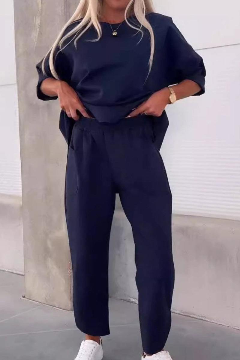 Navy blue relaxed fit two-piece set with crew neck sweatshirt and jogger pants.