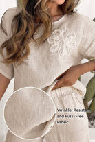 Riviera Petal Two Piece Set in wrinkle-resistant breathable fabric with embroidered floral top and relaxed pants.