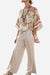 Coastal Comfort Linen two-piece set with floral top and striped wide-leg pants in breathable fabric