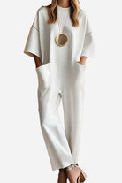 Serene Minimalist Pocket Jumpsuit in white with loose fit and deep side pockets