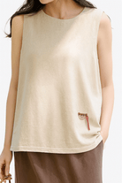 Dandelion Fields Cotton Linen sleeveless top in soft beige with relaxed fit and small embroidered detail.