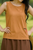 Women wearing Dandelion Fields Cotton Linen sleeveless top in brown with embroidery detail