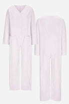 Front and back view of a light lavender relaxed jumpsuit with button-front, long sleeves, and pockets