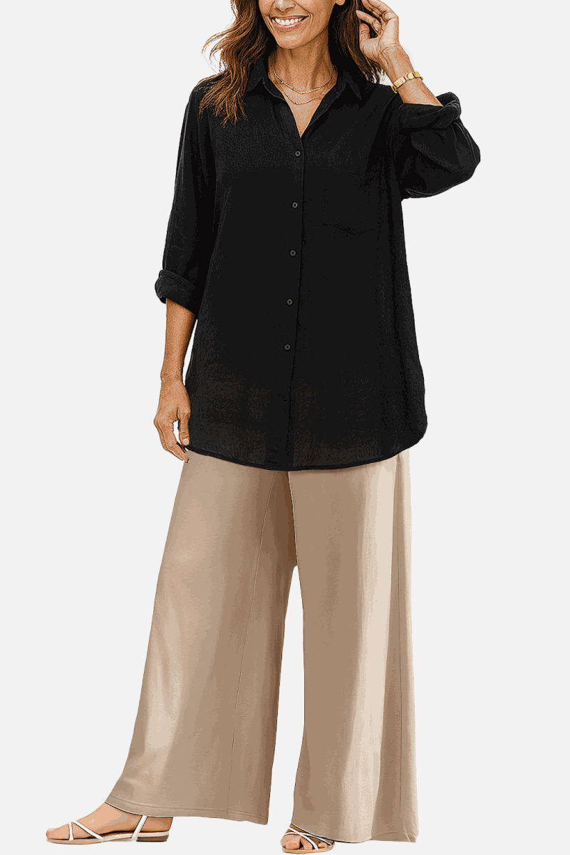 Woman wearing oversized black linen-blend shirt with beige wide-leg palazzo pants from the Oversized Linen Leaved-IN Set.