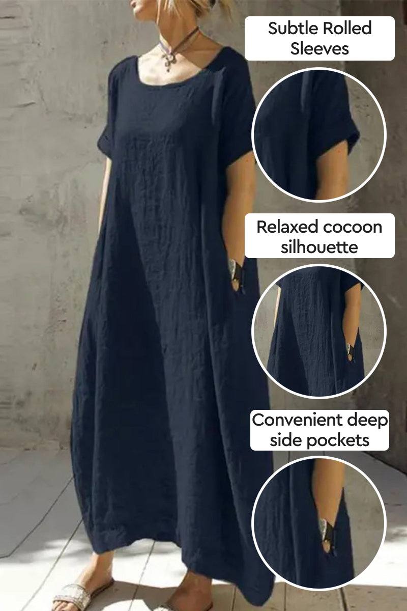 Breeze Cocoon Dress in navy with rolled sleeves, relaxed cocoon silhouette, and deep side pockets for casual elegance