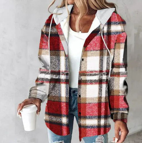 Woman wearing red and brown Highland Plaid Shacket with hood, holding a white cup, styled casually with white top and jeans