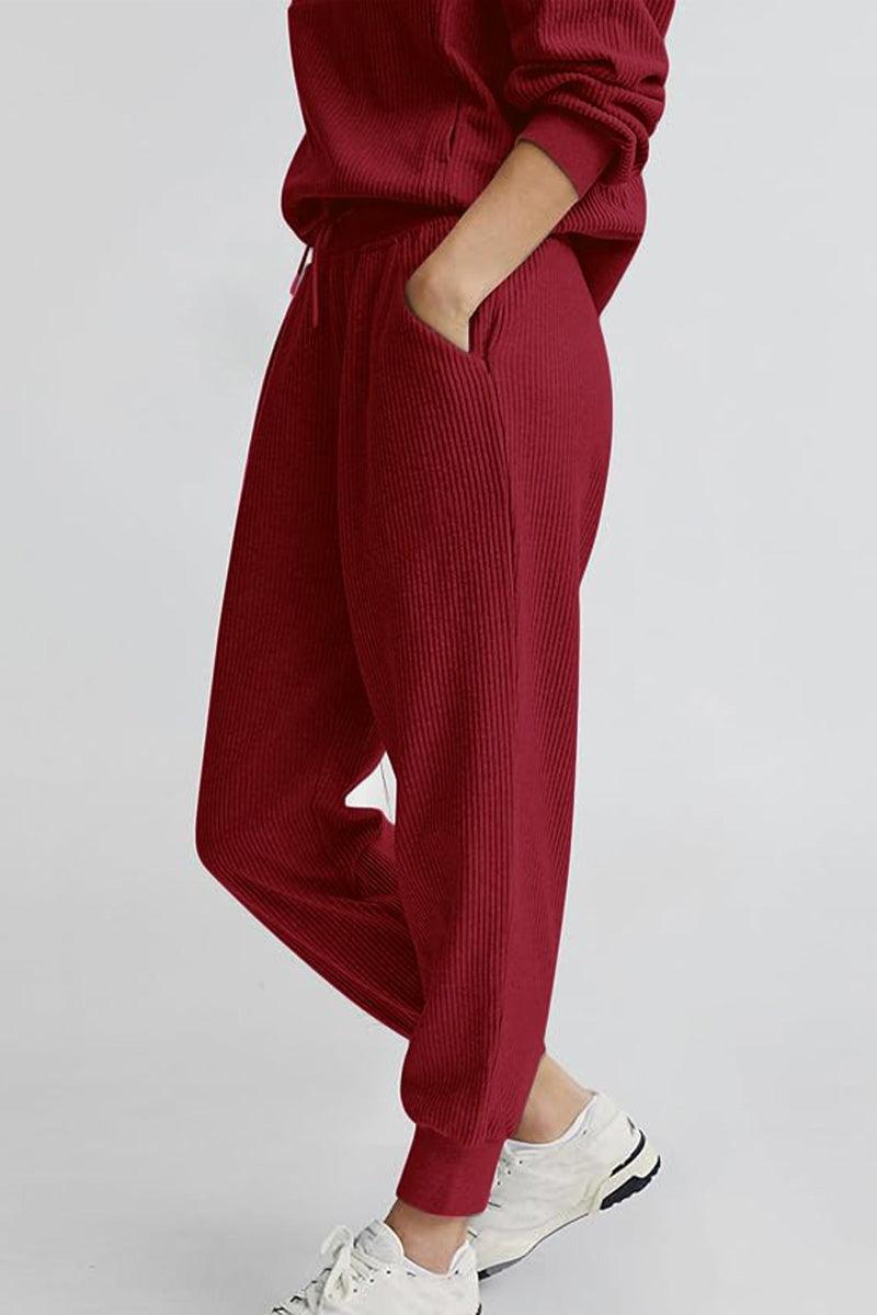 Unisex half-zip pullover and sweatpants set in red with breathable polyester blend and casual fit