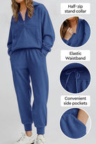 Unisex half-zip pullover and sweatpants set in blue with stand collar, elastic waistband, and side pockets