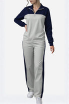 Woman wearing Colorblock Comfort Leisure Set with navy and gray half-zip top and wide-leg pants